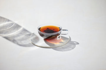 Black Tea Vs. Green Tea what you need to know showing a cup of black tea